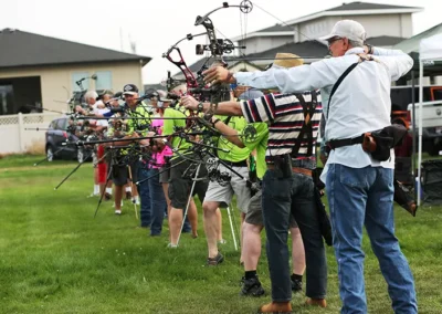 Archers aiming during outdoor event