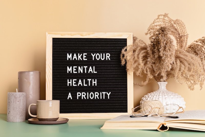 Make your mental health a priority motivational quote on the letter board. Inspiration psycological text in the interior