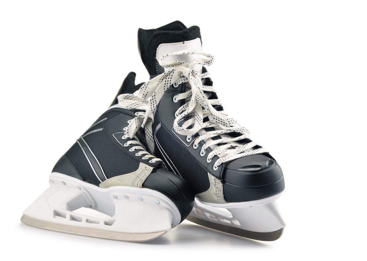 Pair of ice hockey skates isolated on white background.